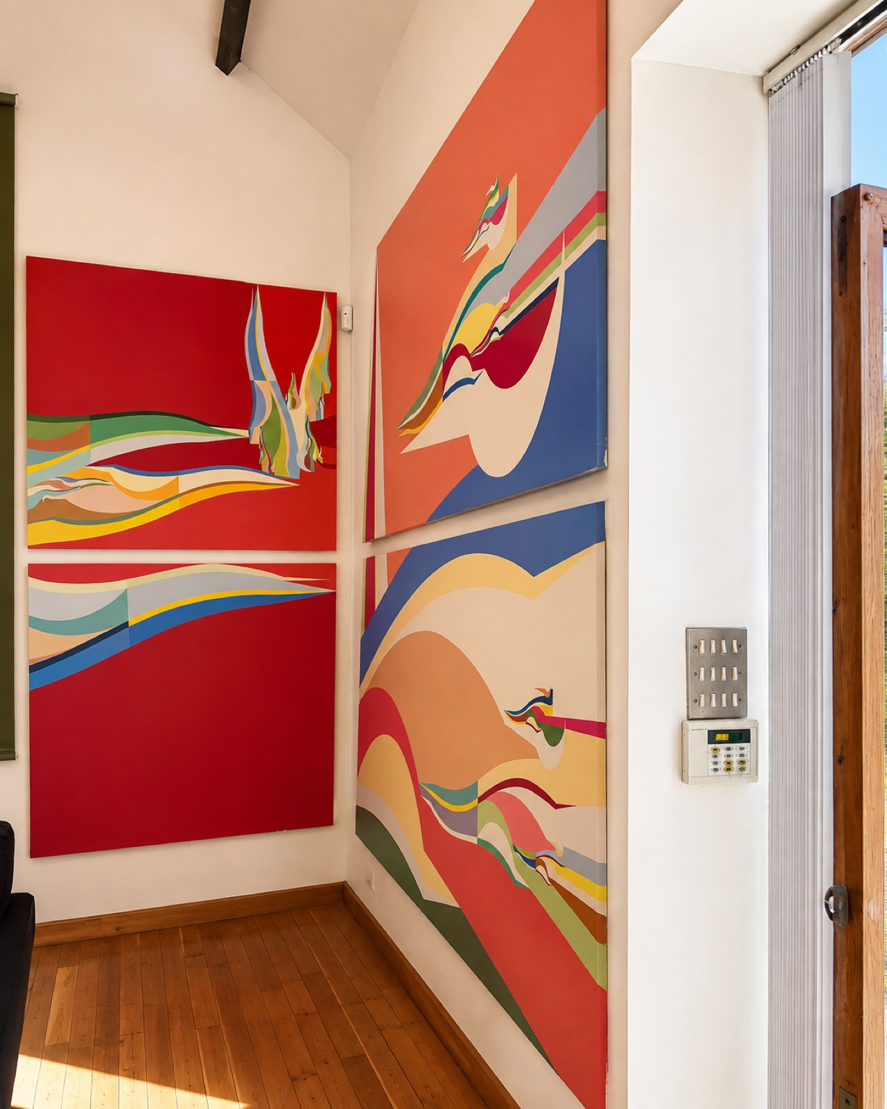 Large colourful art reproductions installed across two walls