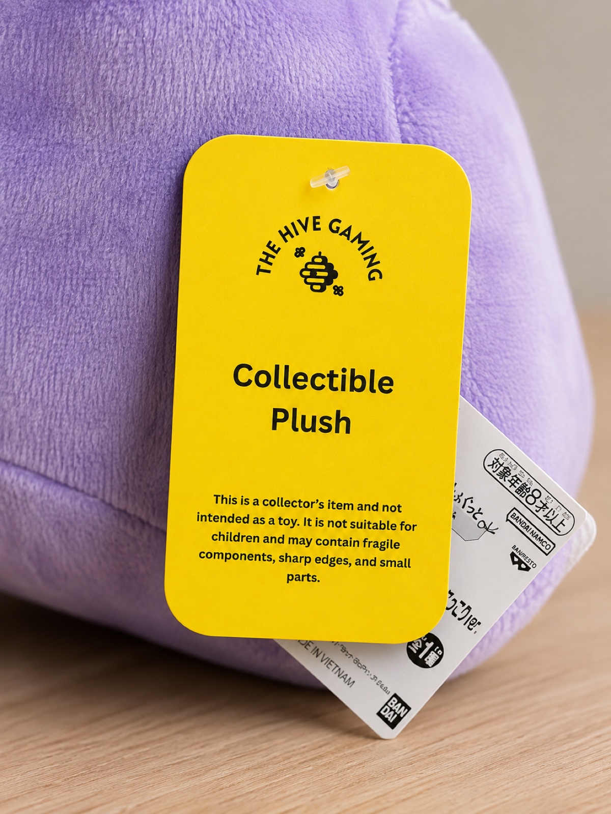 Bright yellow product information tag printed for The Hive Gaming